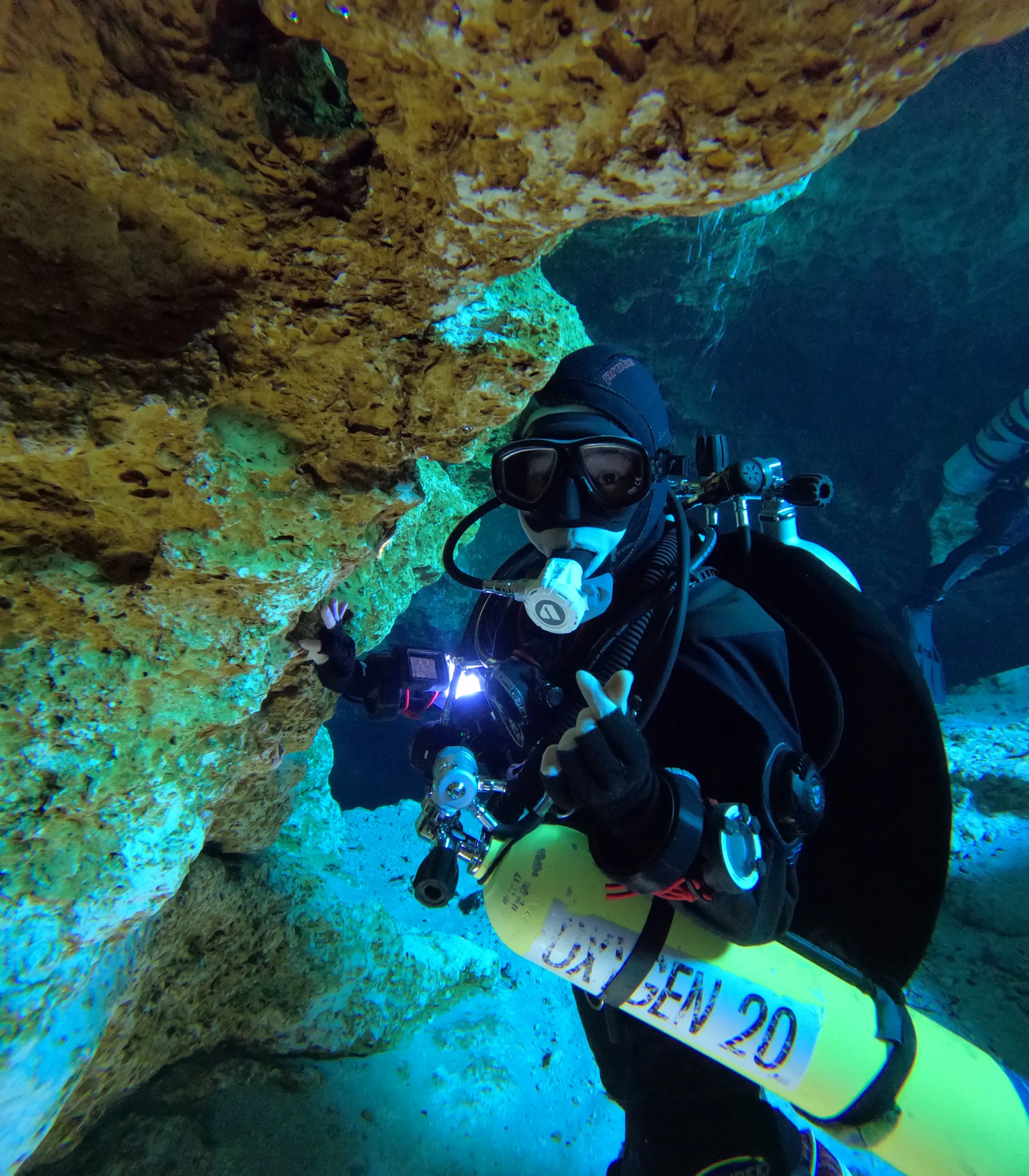 Diver on decompression stop inside Little River Springs cave entrance, Florida