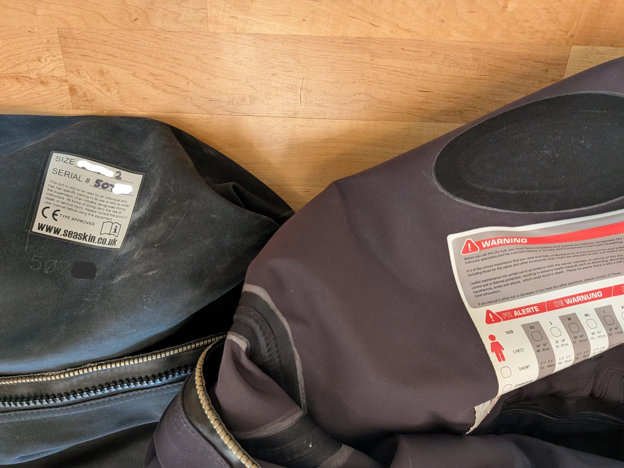 Seaskin Nova and O'Three 90Ninety Hybrid drysuit interior lining and manufacturer label comparison